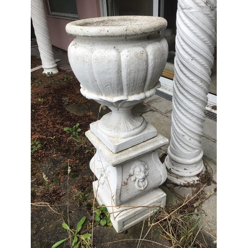 2073 - A composition garden urn and stand of classical influences with stylised acanthus leaves the base wi... 