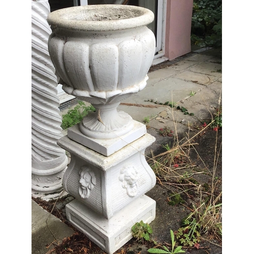 2073 - A composition garden urn and stand of classical influences with stylised acanthus leaves the base wi... 