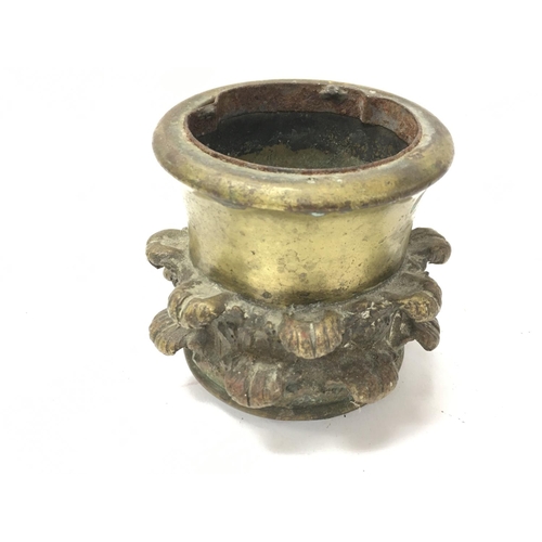 834 - An early 19th century bronze metal cup with stylised acanthus leaves. Approximately 9cm diameter and... 