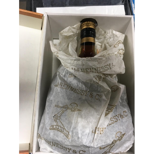 835 - A bottle of cognac Hennessy Extra .