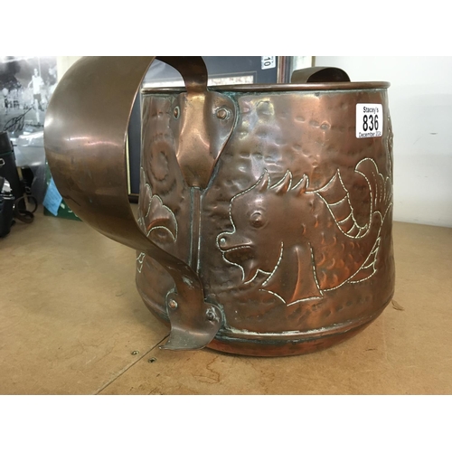 836 - A Newlyn style copper jardiniere with twin arts and crafts handles decorated with fish . 23 cm heigh... 