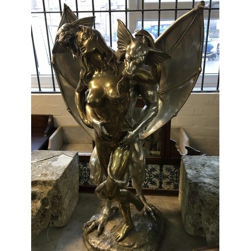 837 - A Modern Contemporary erotic bronze statue of nude female embraced by a two headed dragon. The sculp... 