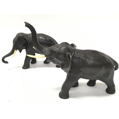 900 - A pair of Japanese small bronze elephant figures ,one marked at the base. Approx 8cm tall. Postage c... 