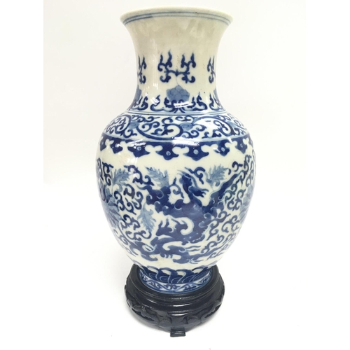 901 - A Chinese blue and white Phoenix porcelain vase. 13cm tall. This lot cannot be posted.