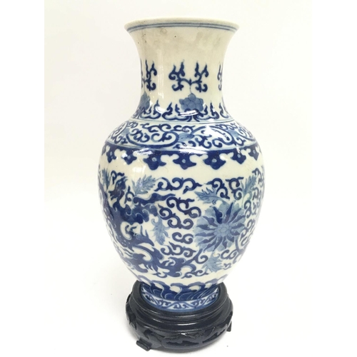 901 - A Chinese blue and white Phoenix porcelain vase. 13cm tall. This lot cannot be posted.