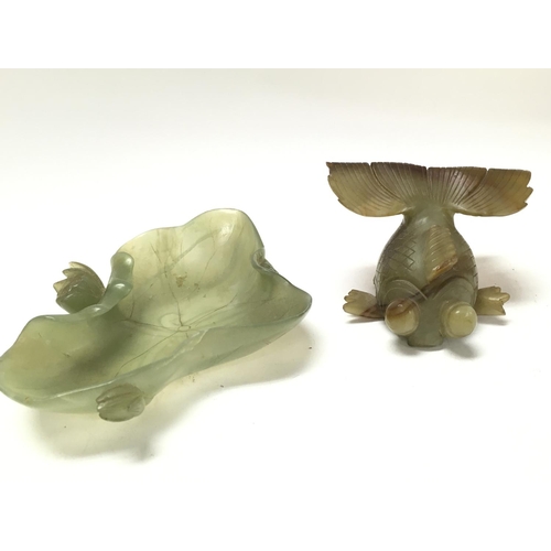 904 - Two carved Chinese jade items, a fish figure and a dish. This lot cannot be posted