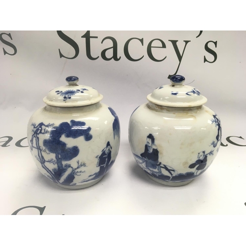 928 - A pair of blue and white ginger jars decorated with figures in a landscape setting, four character m... 