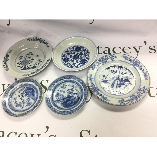 934 - Five blue and white dishes, largest diameter approx 23cm. Some damages. Shipping category D.