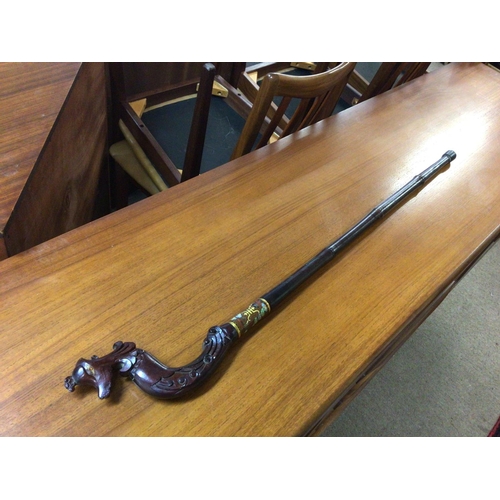 955 - A Chinese wooden walking stick with a phoenix head shaped handle and a cloisonne collar. No reserve