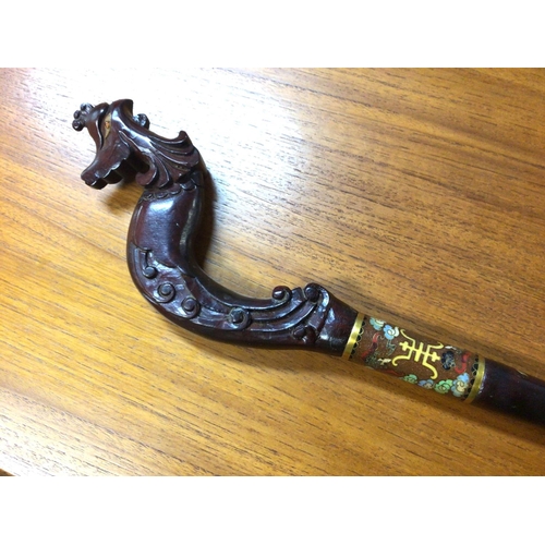 955 - A Chinese wooden walking stick with a phoenix head shaped handle and a cloisonne collar. No reserve