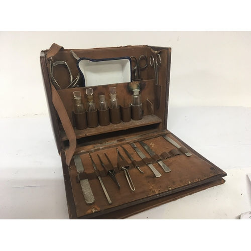 2113 - A Vintage leather surgeon case fitted with medical instruments and a Vintage typewriter and a typewr... 