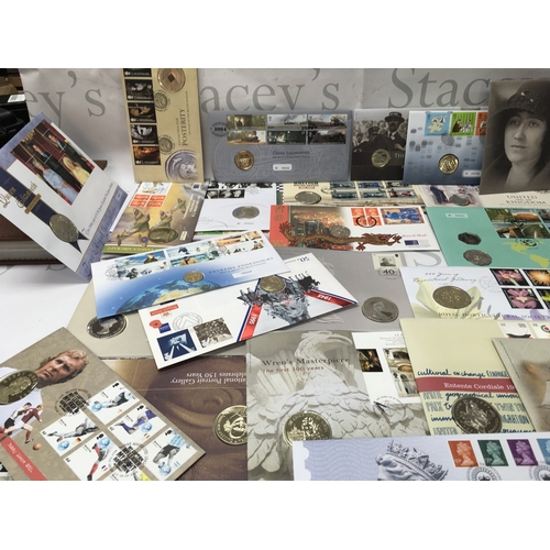 108 - A collection of coin and stamp presentations packs. Postage B