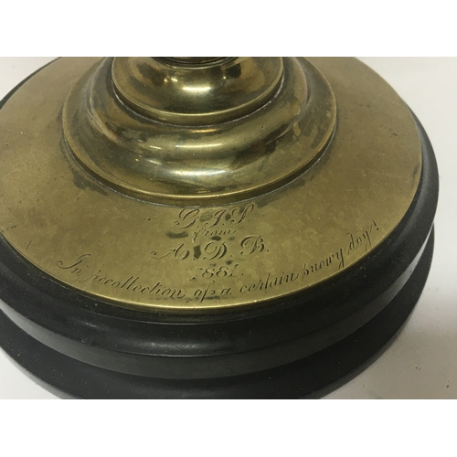 120 - A Victorian brass clock barometer with a revolving Spherical ball. No Reserve. Height 33cm. With key