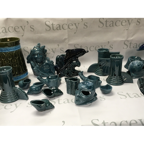 137 - A collection of turquoise and black ceramics including dolphins tombstone etc. No reserve.