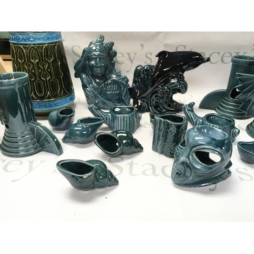 137 - A collection of turquoise and black ceramics including dolphins tombstone etc. No reserve.