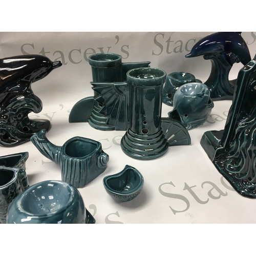 137 - A collection of turquoise and black ceramics including dolphins tombstone etc. No reserve.