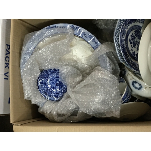 149 - Two boxes containing a quantity of mixed blue and white ceramics. NO RESERVE