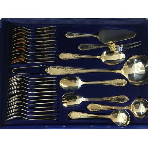 171 - Golden cutlery including large spoons, tablespoons, teaspoons, forks, knives and other cutlery items... 