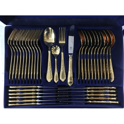 171 - Golden cutlery including large spoons, tablespoons, teaspoons, forks, knives and other cutlery items... 