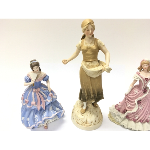 181 - Two Wedgewood figures and a Royal Dux figure. Note damage to fan of one as pictured. Postage D. NO R... 