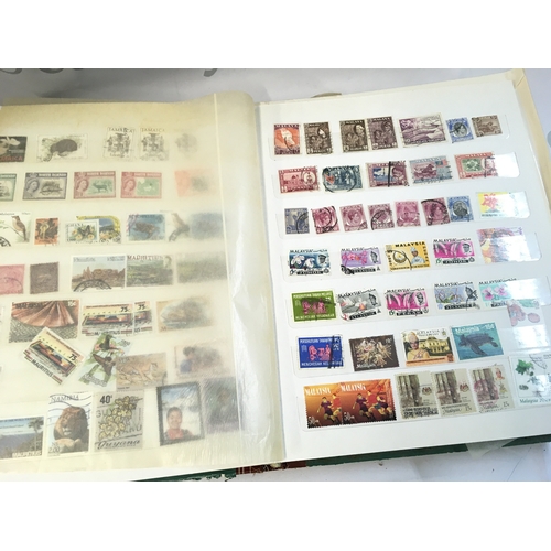 211 - World Stamp albums including used and unused stamps from Barbados, Cyprus, Gibraltar, UK, Canada etc