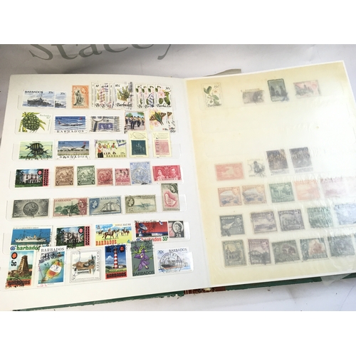 211 - World Stamp albums including used and unused stamps from Barbados, Cyprus, Gibraltar, UK, Canada etc