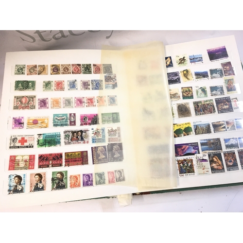 211 - World Stamp albums including used and unused stamps from Barbados, Cyprus, Gibraltar, UK, Canada etc