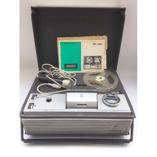 272 - A Grundig TK140 reel to reel with manual and microphone together with a GEC reel to reel with microp... 