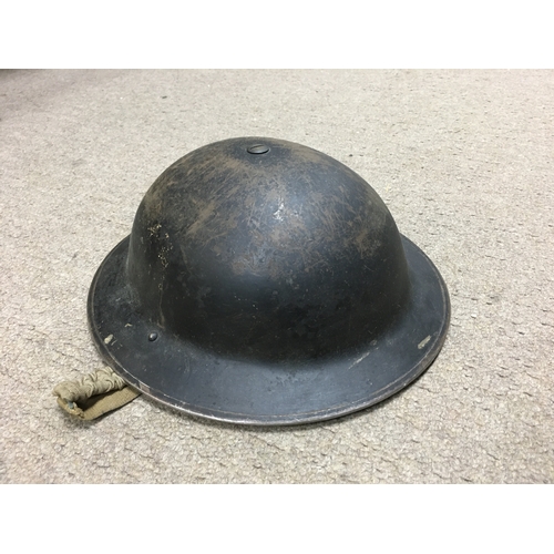 29 - A Collection of WW1 & 2 items including a childrenâs gas mask, a soldiers helmet and various bags.