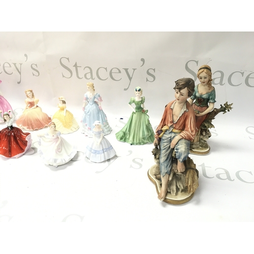 297 - A collection of assorted ceramics figurines including Royal Doulton Coalport etc.