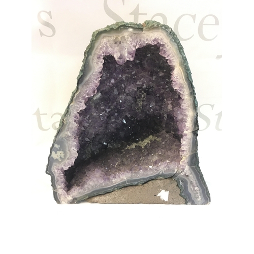 327 - An Ameythst Geode 24cm tall 22cm wide