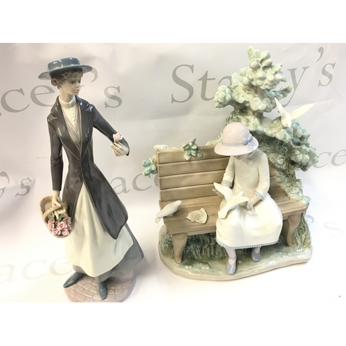 328 - Lladro boxed figures including Tokens of love, girl on a bench feeding doves and a boxed Disney show... 