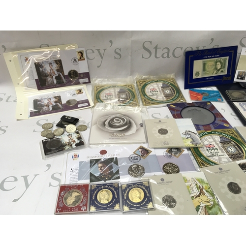 332 - A collection of coinage including uncirculated coin sets and a number of commemorative 50p. Postage ... 