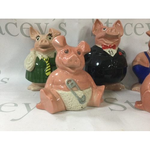 352 - A collection of antique pig money boxes from 1980s NatWest. Includes all 5 of the pigs and 2 extra s... 