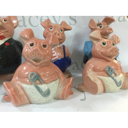 352 - A collection of antique pig money boxes from 1980s NatWest. Includes all 5 of the pigs and 2 extra s... 