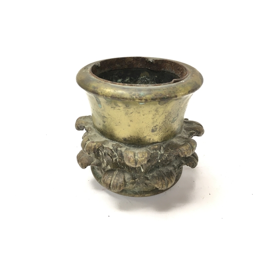 373 - An early 19th century bronze metal cup with stylised acanthus leaves. Approximately 9cm diameter and... 