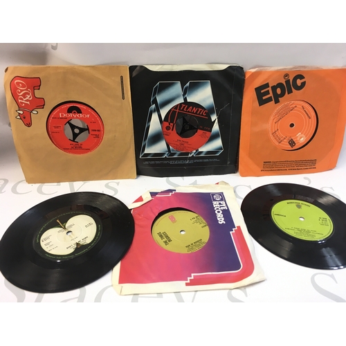 38 - A Collection of rock and pop 7 inch singles including Alice Cooper, Trex, ELO, David Bowie etc.