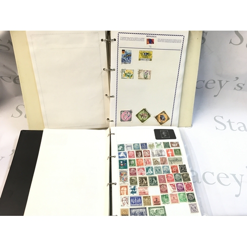 419 - A large collection of World Stamp albums containing unused and used stamps from Germany, Bulgaria, C... 