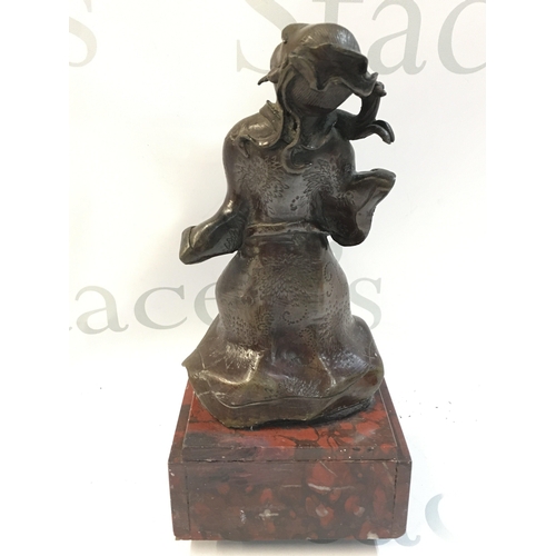 425 - A late 19th century Japanese bronze figure on a marble base pedestal, 23cm tall.