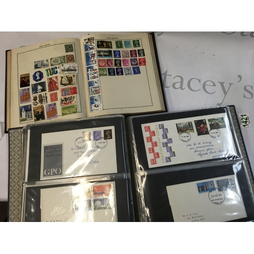 428 - A Collection of first day cover albums and a stamp album containing GB stamps and some world.