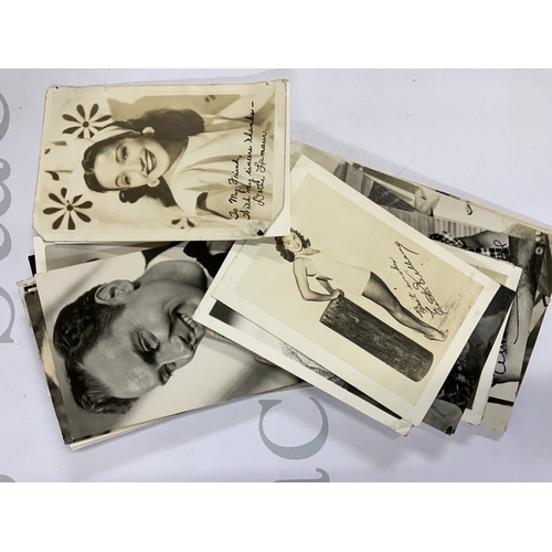 439 - A collection of film star photos, a book of press cuttings and a large family bible.( D) NO RESERVE