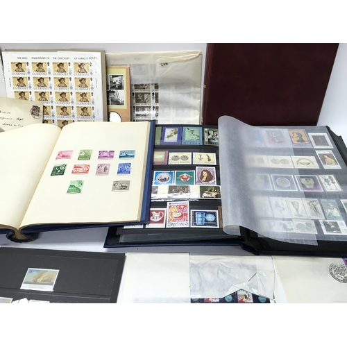 443 - A large collection of stamp albums and loose stamps and stamp sheets. Postage C. NO RESERVE