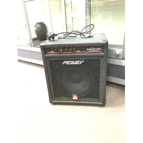 512 - An Encore electric guitar and carry case together with a Peavey amplifier (2).