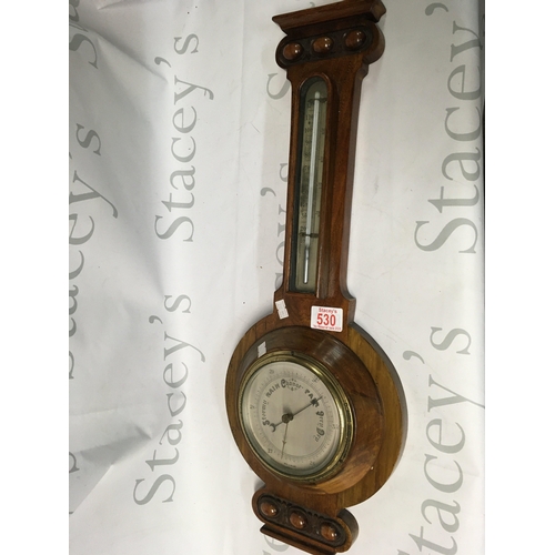 530 - An antique barometer clock.