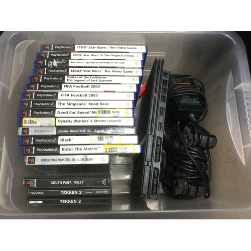 547 - A slimline PS2 Playstation console, games and accessories.