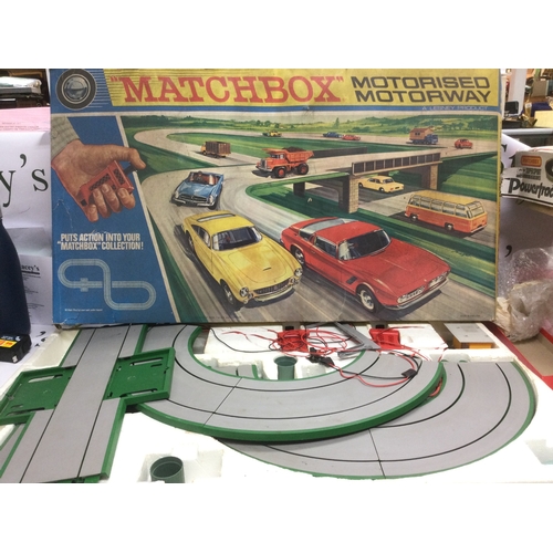 549 - Three boxed racing games comprising a Matchbox M2 motorised motorway, a Tyco Nigel Mansell racing se... 