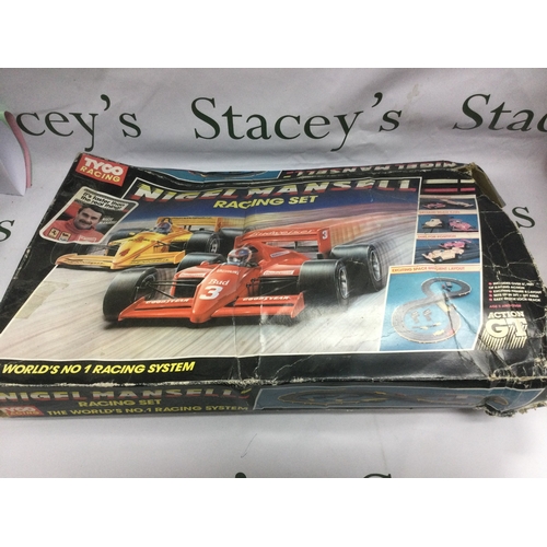 549 - Three boxed racing games comprising a Matchbox M2 motorised motorway, a Tyco Nigel Mansell racing se... 