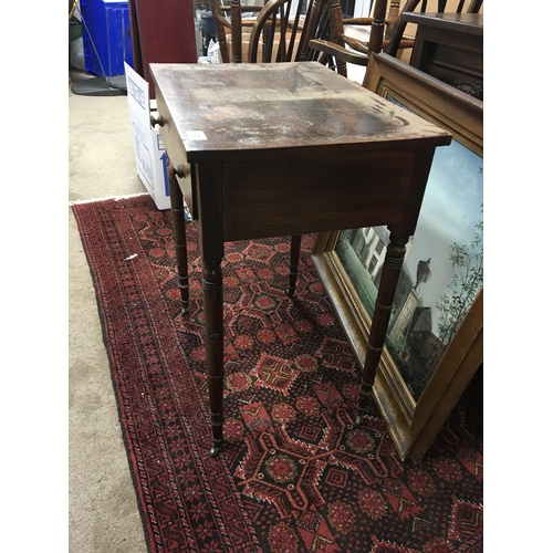 551 - A late George III mahogany side table the rectangular top above a single drawer on ring turned legs ... 