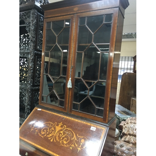 571 - A Edwardian mahogany inlaid bureau bookcase with a pair of glazed doors above a fall front with thre... 