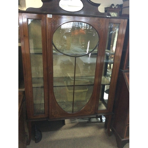 587 - A Edwardian mahogany display cabinet the glazed door enclosing fitted shelves on cabriole Legs . NO ... 